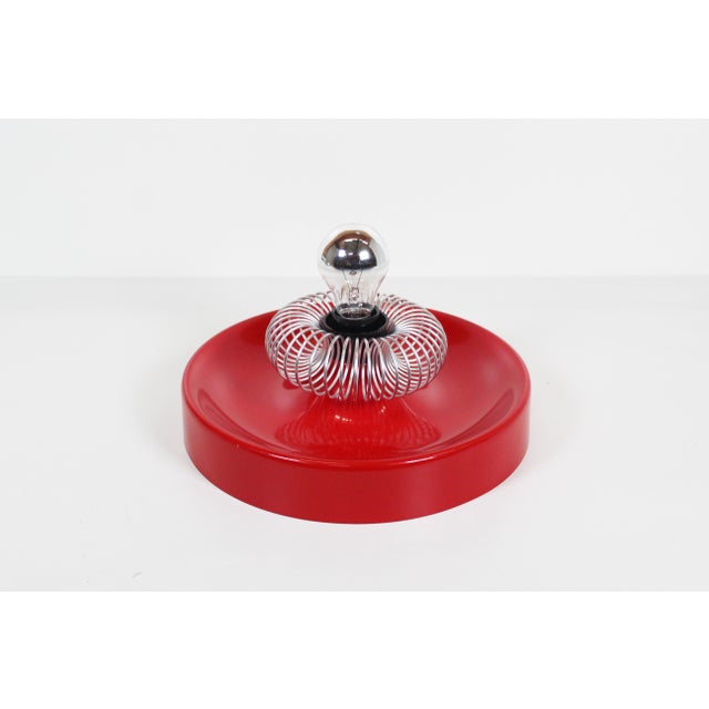 Metal space age wall light by Phillipe Rogier. Made in Germany during the 1970’s. In great and fully original condition...