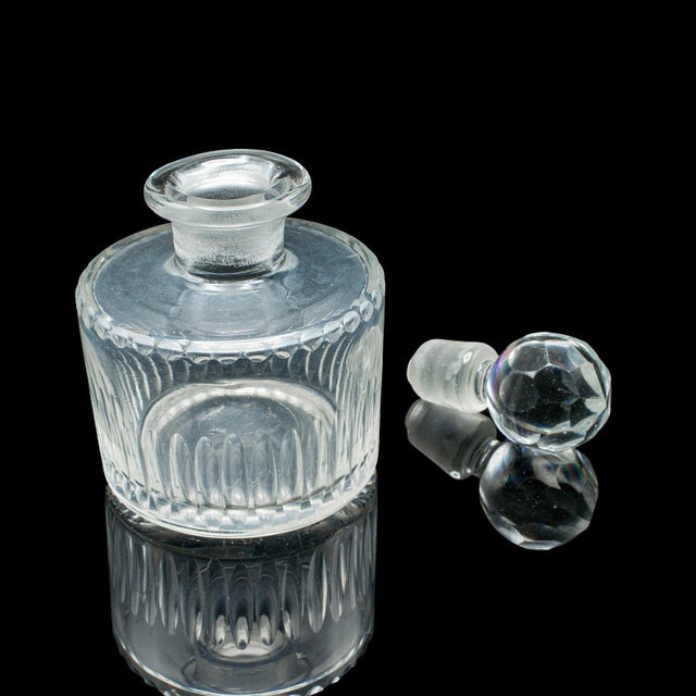 This is an antique perfume bottle. An English, glass scent dispenser, dating to the early Victorian period, circa 1850. A...