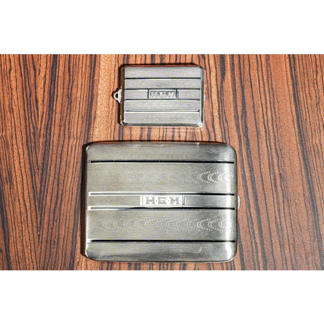 Elevate your collection with this stunning Art Deco sterling silver and enamel cigarette case and vesta (match holder) set...