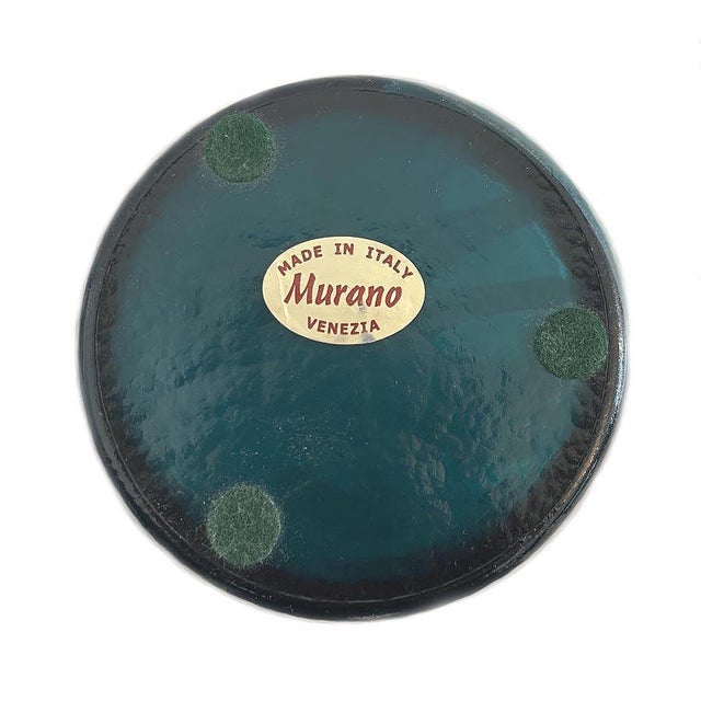 This vase has a semi matte textured finish on the outside. The interior is smooth with an iridescent shine. Beautiful...