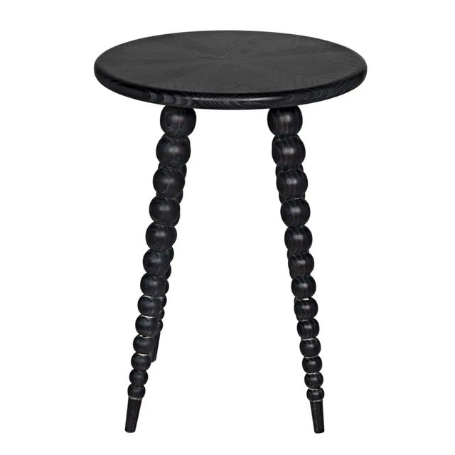 Crafted with precision and attention to detail, this side table features a Mindi material with a sophisticated Cinder...