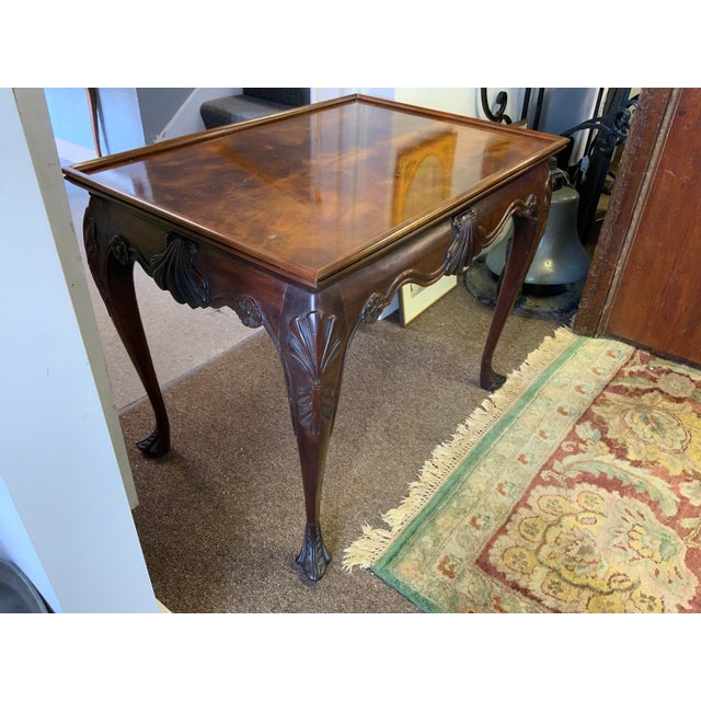 High quality American made carved mahogany side table, by Baker. Beautiful Irish Georgian carved detail. Sturdy in stature.