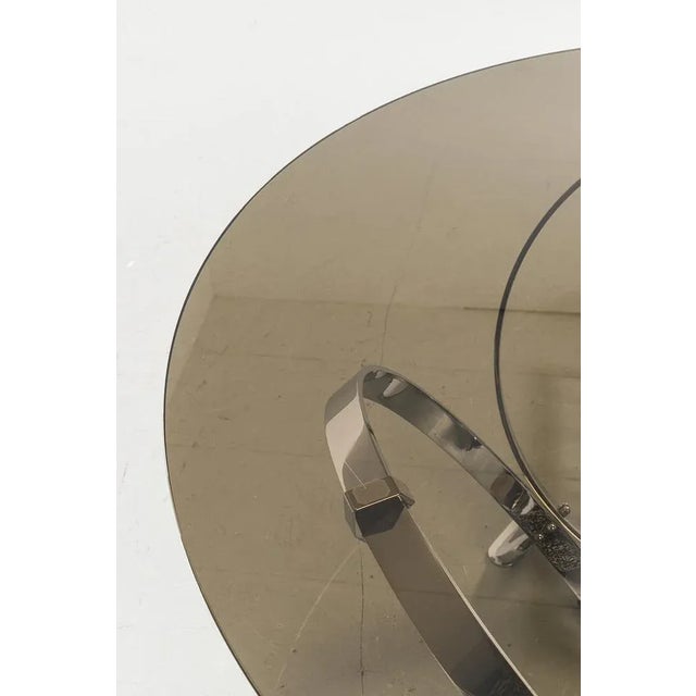 Beautiful round smoked glass coffee table with chrome base. This coffee table was designed by Knut Hesterberg. A beautiful...