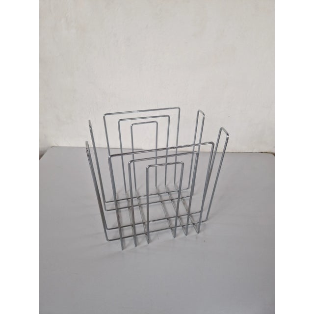 Vintage chrome plated magazine rack in of style Willi Glaeser for TMP, 1980s Chrome-plated newspaper rack. The design is...
