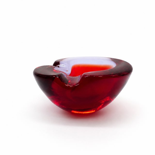 An elegant Murano glass ashtray or trinket dish made by Seguso Murano in Italy around 1960. This solid glass piece...