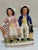 A good original Staffordshire flat back figurines. Cricket Man and tennis woman. The hand painted ceramic figures are in...