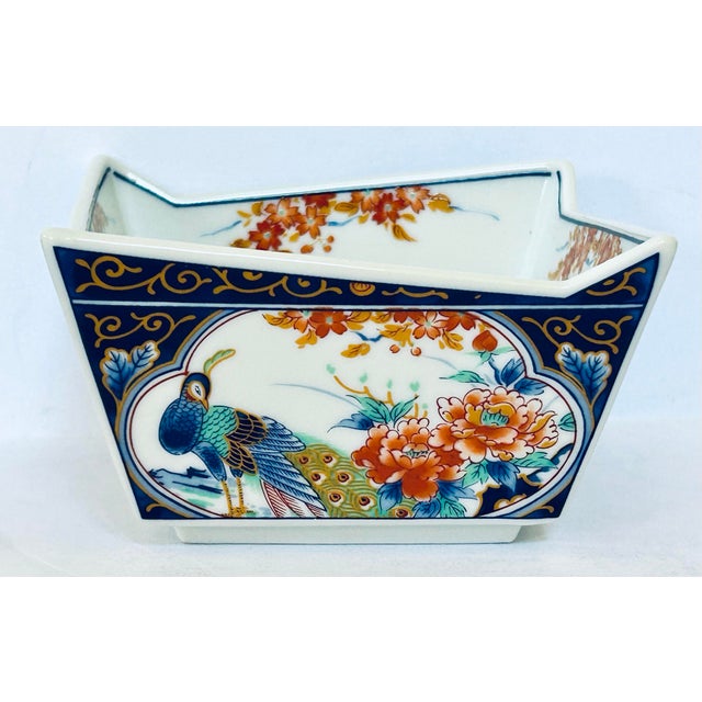 Set of 4 Asian rice bowls with alternating peacock and floral motifs on the sides and crimson branches inside. Decorative...