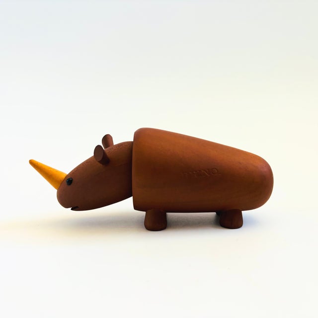A mid century turned wood figurine in the shape of a Rhino. Adorable stylized features. Made in Japan by Senshukai as part...