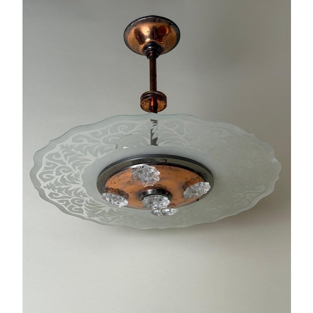 Allow me to introduce you to this stunning Art Deco chandelier from the world-renowned Ezan brand. It was crafted in...