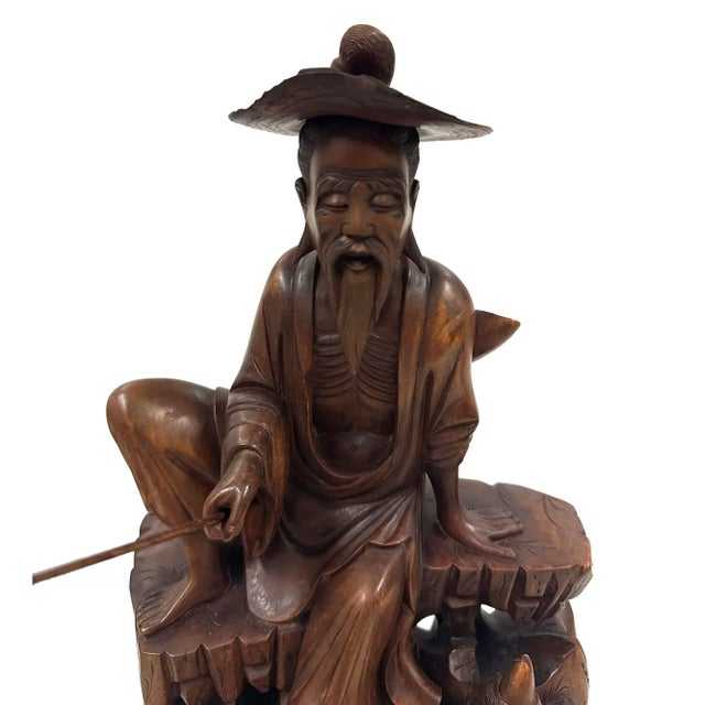 This is a Chinese hand-carved wooden statue, depicting the legendary figure Jiang Ziya (also known as Jiang Taigong), a...