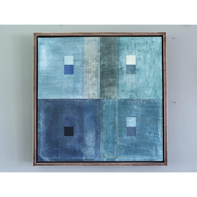 GEOMETRIC COLLAGE IN BLUES Size: 16.9 x 16.9 inches (including frame) Mixed media on wooden panel A very unique original...