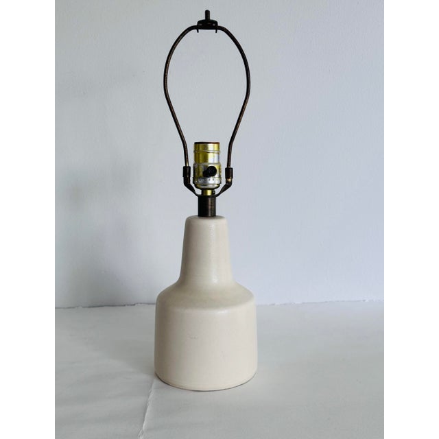 Vintage 1960s White Ceramic Table Lamp in the Style of Lotte & Gunnar Bostlund, Denmark. The lamp has a beautiful matte...