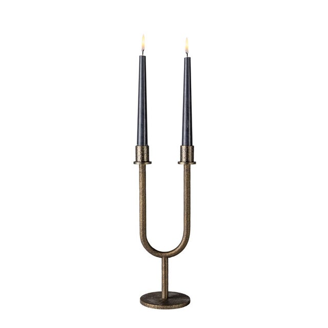 Deneb is a two-arm candelabra made of hammered brass and crafted in Italy, reinterpreting a classic form through a unique...