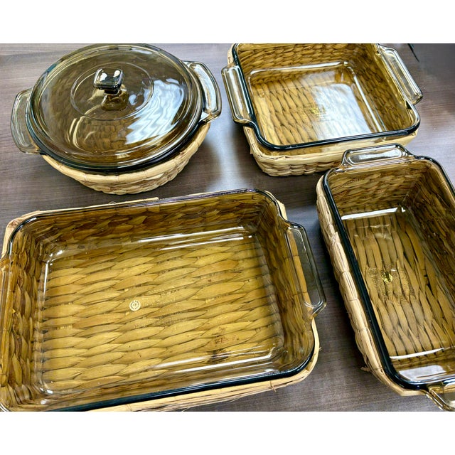 Beautiful vintage amber glass baking dishes by Anchor Hocking, each paired with its original rattan basket for an earthy,...