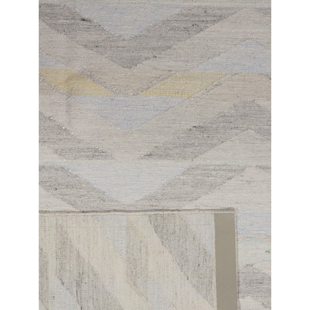 Handwoven in India using a combination of wool & viscose this Kilim has been styled on the clean and simple look of...