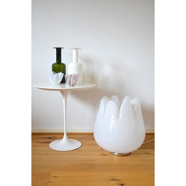 This very rare Murano floor lamp is made of hand-blown milky opal glass resting on a round chrome base, the workmanship is...