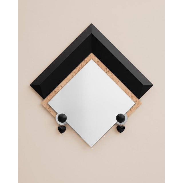 Nefertiti mirror by elina ulvio. Dimensions: w 49 x d 5 x h 55 cm. Materials: curly birch plywood, mirror, polished steel,...
