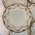 Offered here is a set of 8 French Limoges dinner plates. They feature delicate pink roses and gold encrusted rims. These...