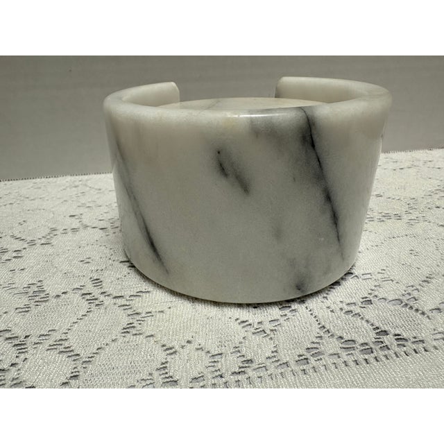 Vintage set of five marble coasters in a marble holder. White creamy alabaster with gray veins. Elegant for any decor style.