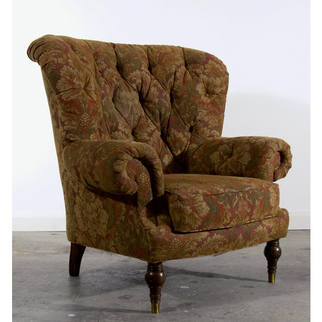 This Sherrill lounge chair has a dramatic curved barrel back with deep diamond tufting, generous scroll arms, and turned...
