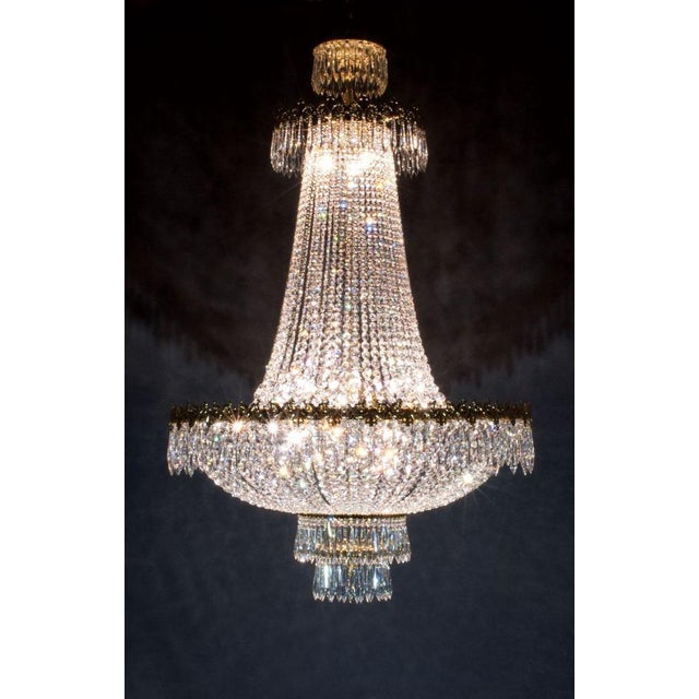 Palace 15 lights chandelier in gold plate and crystal by aggiolight. Dimensions: d 120 x h 160 cm. Materials: gold plate,...