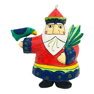 Vintage Folk Art Painted Wood Santa With Bird For Sale