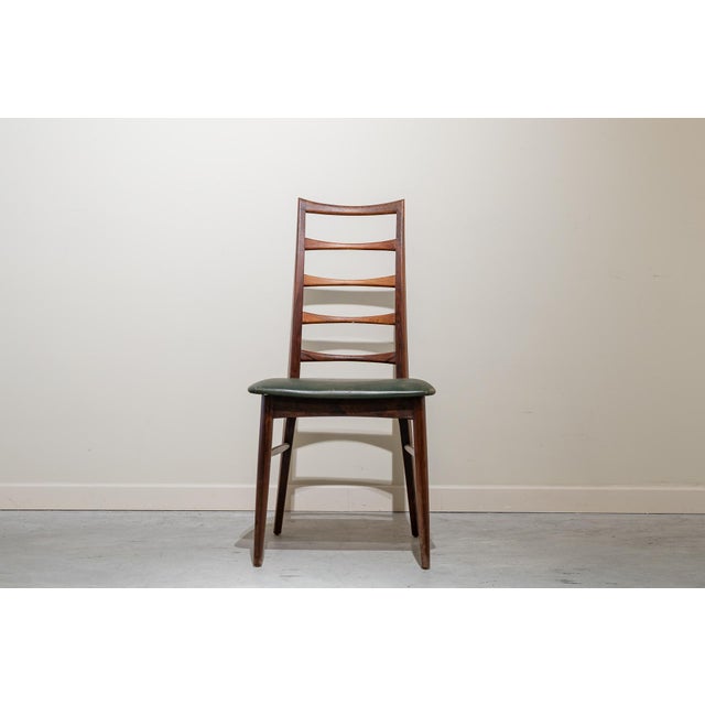 The Lis dining chair, designed by Niels Kofoed for Koefoeds Hornslet in Denmark in the 1960s. It features a high backrest...