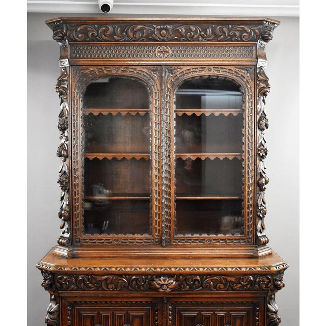 Victorian Carved Oak Bookcase Item Code: S27-1098 A striking late 19th century Victorian carved oak bookcase cabinet of...