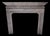 This elegant 20th-century French fireplace is crafted from richly veined marble in a soft palette of blue-grey and dove...