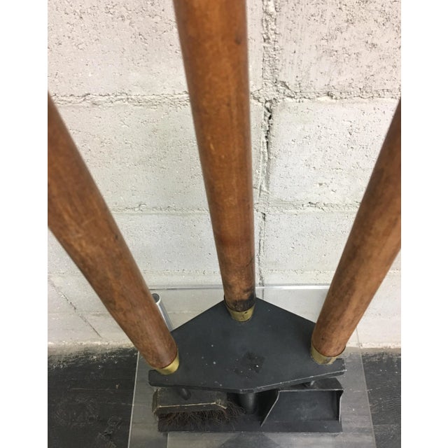 Vintage four piece fireplace tool set. Features cast iron shovel, brush and log grabber with wooden dowel and brass ring...