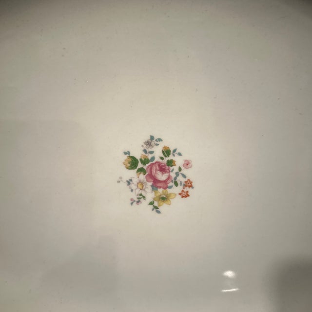 A Beautiful oval delicate spray of floral pattern. With beautiful colors of blue,green, and gold tones is to inspire.