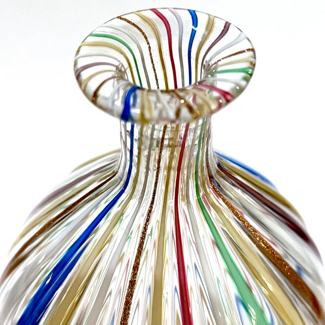 An elegant example of the Venetian art of glassblowing - this eiformige (ovid) vase was blown using the "canne" (cane)...