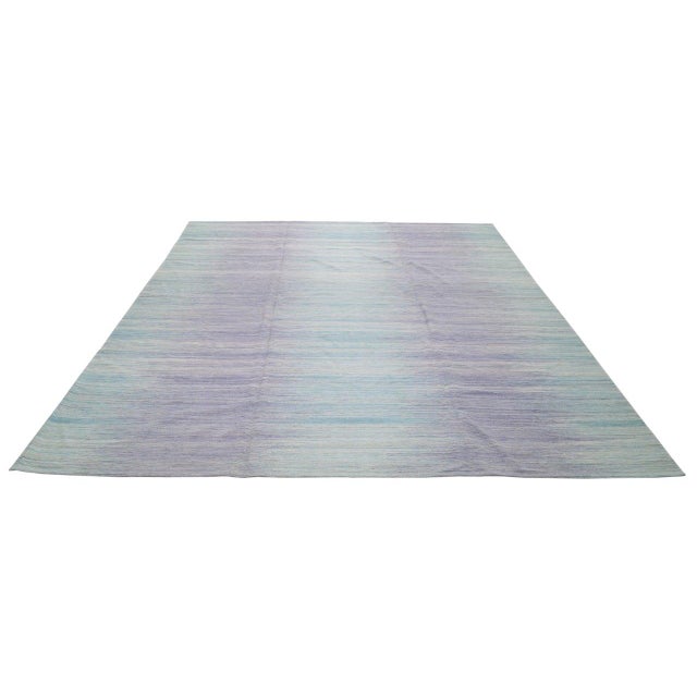 Hand-knotted with care using traditional rug-making techniques, this wool rug blends timeless craftsmanship with a modern...