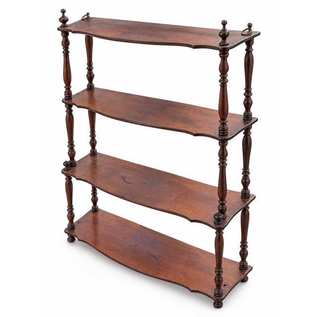 An elegant French wall shelf in the Napoleon III style, made in the late 19th century. This decorative piece consists of...