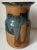 This wonderful vintage studio art pottery glazed vase features Indigo Blue glaze with Brown on a terra cotta pottery body....