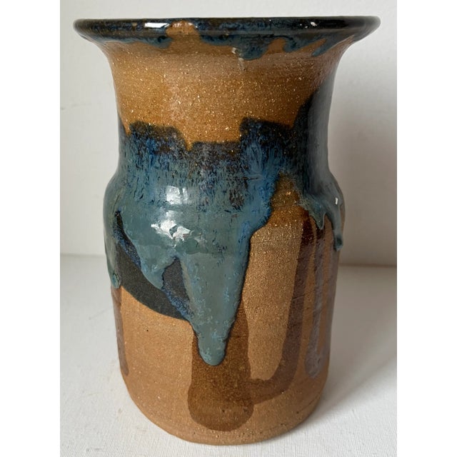 This wonderful vintage studio art pottery glazed vase features Indigo Blue glaze with Brown on a terra cotta pottery body....