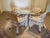 Fantastic vintage WHEAT SHEAF dining/breakfast table with four simulated BAMBOO chairs on rollers! This set is attributed...
