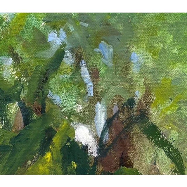 In "After the Rain," vibrant blooms emerge from a lush, green backdrop, their petals glistening with moisture. The loose...