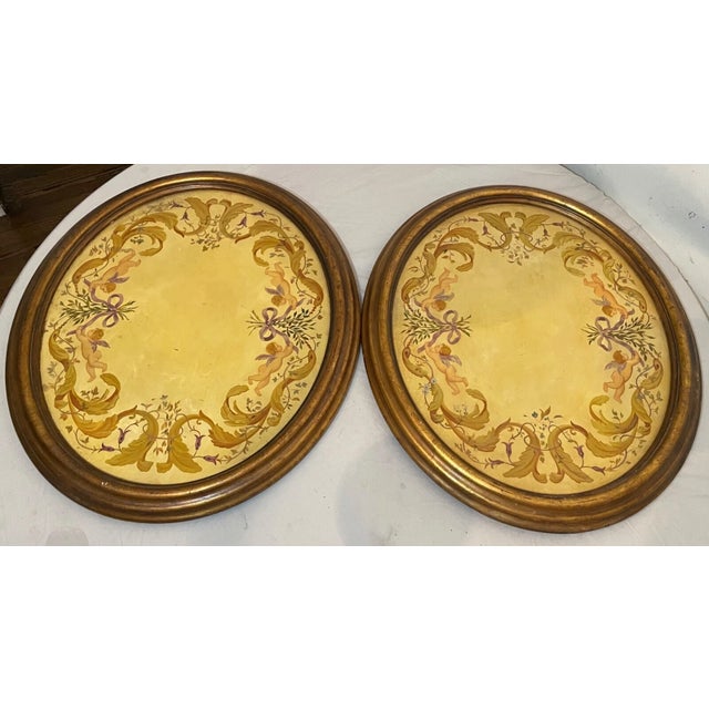 Up for sale is a large pair of vintage original hand painted oval frescos done on wood. They are panted with a lovely...
