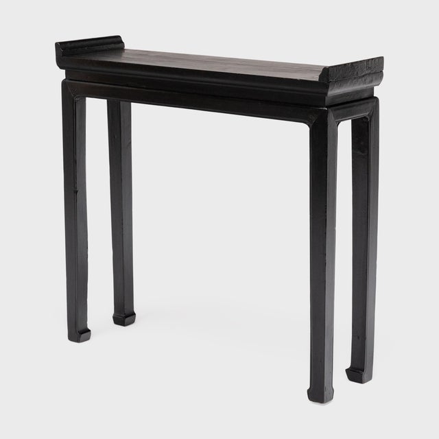This shallow altar table once resided in a 19th-century Chinese home, laden with food offerings and incense as a home...