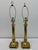 This handsome pair of vintage brass table lamps features elegant Neoclassical styling with tall fluted columns, rope-twist...