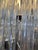 Spectacular Italian chandelier in Murano glass, composed of a multitude of long, cascading, prismatic crystal glass rods...