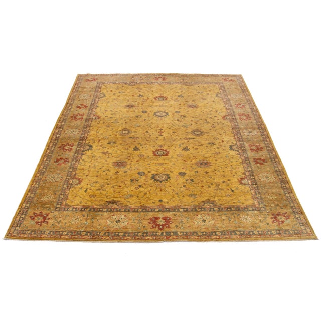 Handmade Paki Peshawar wool Rug with goldenrod field in an all-over floral design in gray and rust. This rug measures 10'...