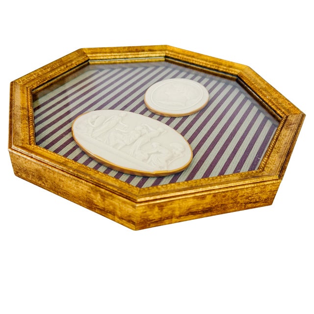 An exquisite shadow box wall art featuring two Neoclassical Grand Tour-style plaster relief medallions. Mounted against a...