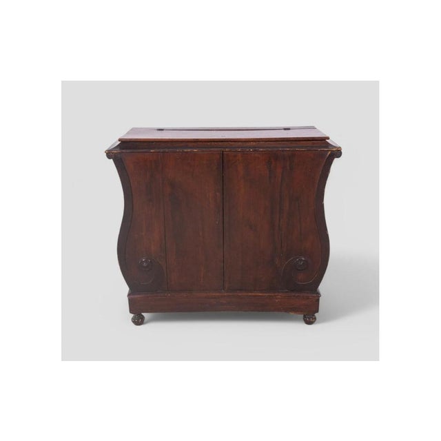 This charming 19th-century storage piece is a fine example of traditional Italian craftsmanship, featuring elegant lines...