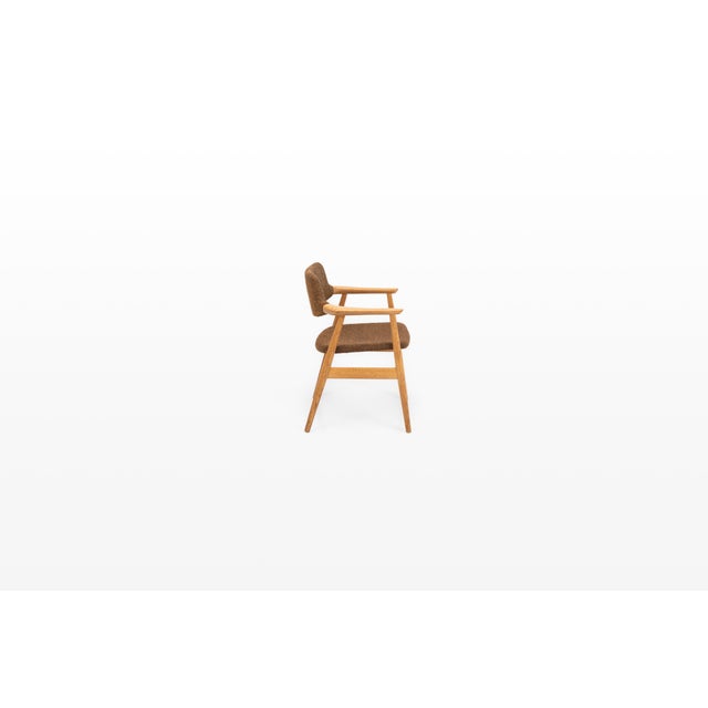 Vintage GM11 armchair designed by Svend Åge Eriksen for Glostrup Møbelfabrik, Denmark. Crafted in oak, the chair features...