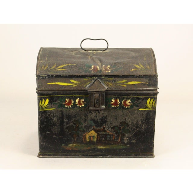 An early and impressive American tin toleware box Shaped as a chest, with arched top, all hand crafted with folded rims...