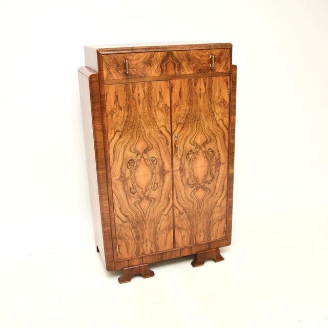 A beautiful original Art Deco figured walnut compactum wardrobe. This was made in England, it dates from the 1930’s. It is...
