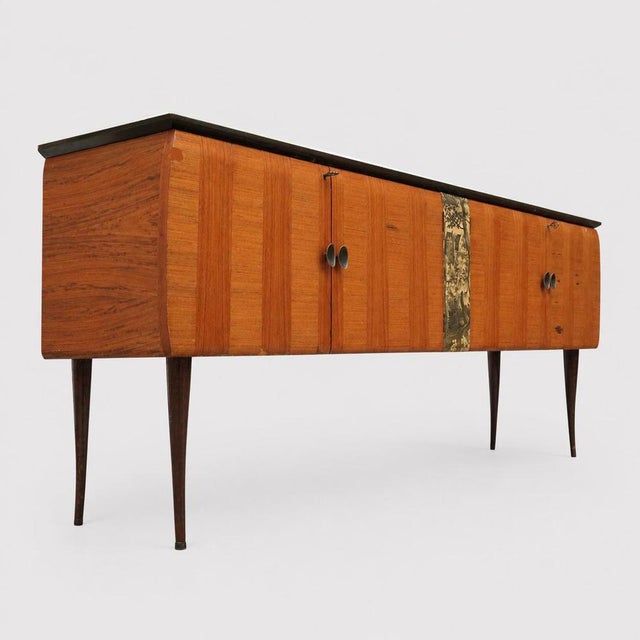 This characterful Italian vintage sideboard has an elegant appearance reminiscent of the refined designs of Vittorio...