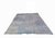 This designer rug stands out for its striking asymmetrical composition. One side features concentric rhombuses and high-...